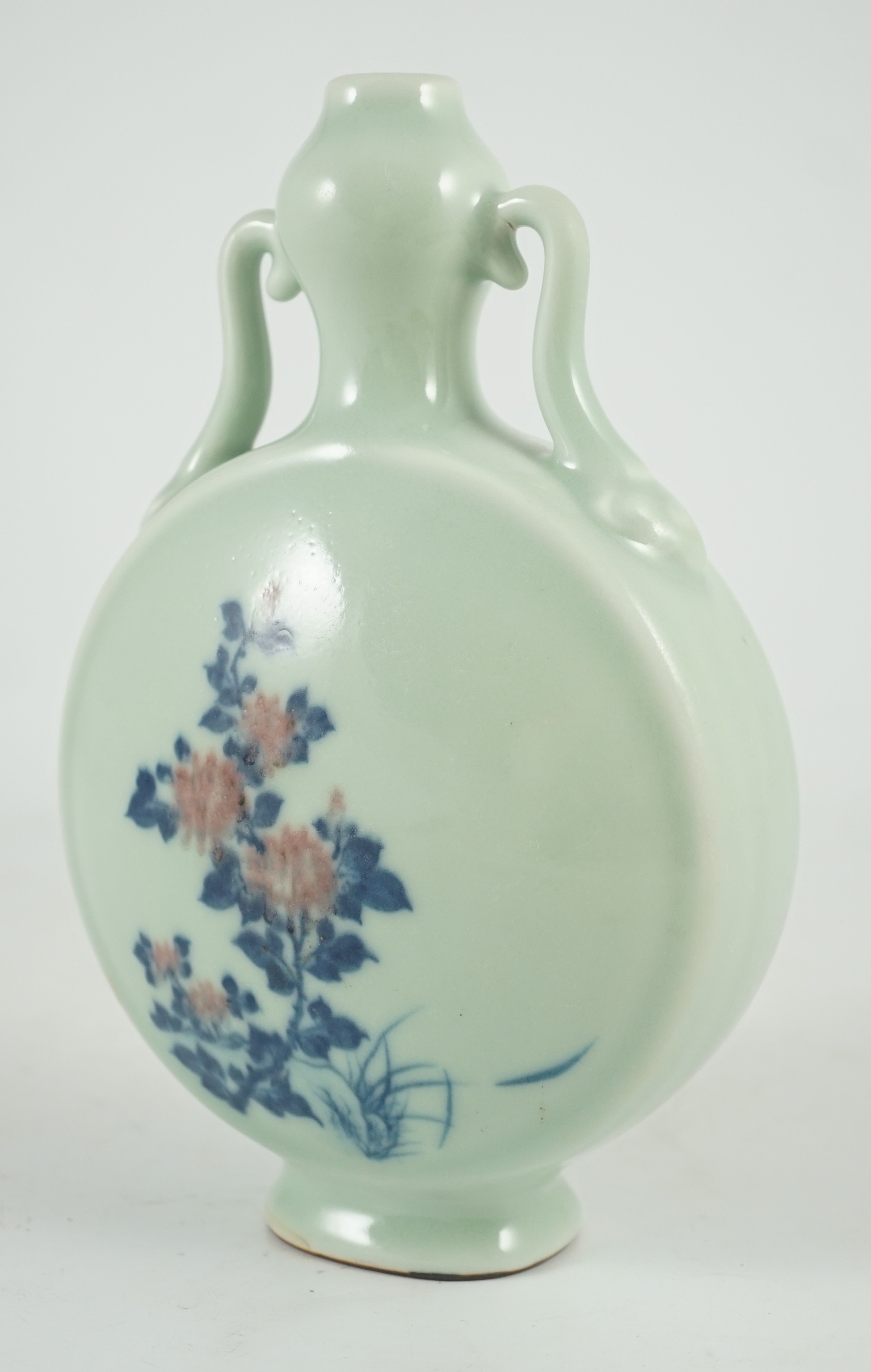 A Chinese underglaze blue and copper red inscribed celadon ground moonflask, 21cm high
